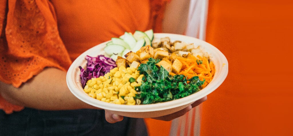 Closeup of a person holding a BIBIBOP Bowl