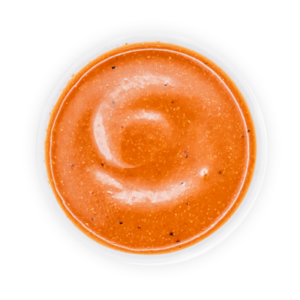 A cup of BIBIBOP Spicy Sriracha sauce