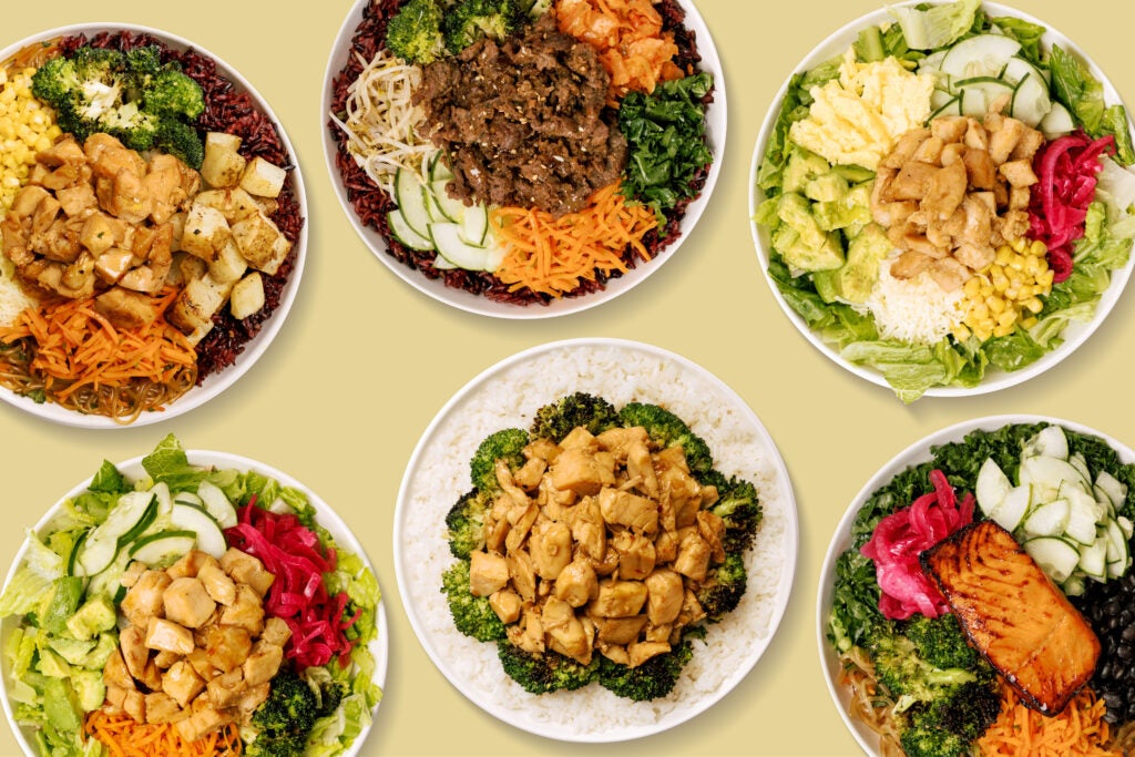 Bowls of fresh Bibibop Asian food rice with assorted meats and vegetables