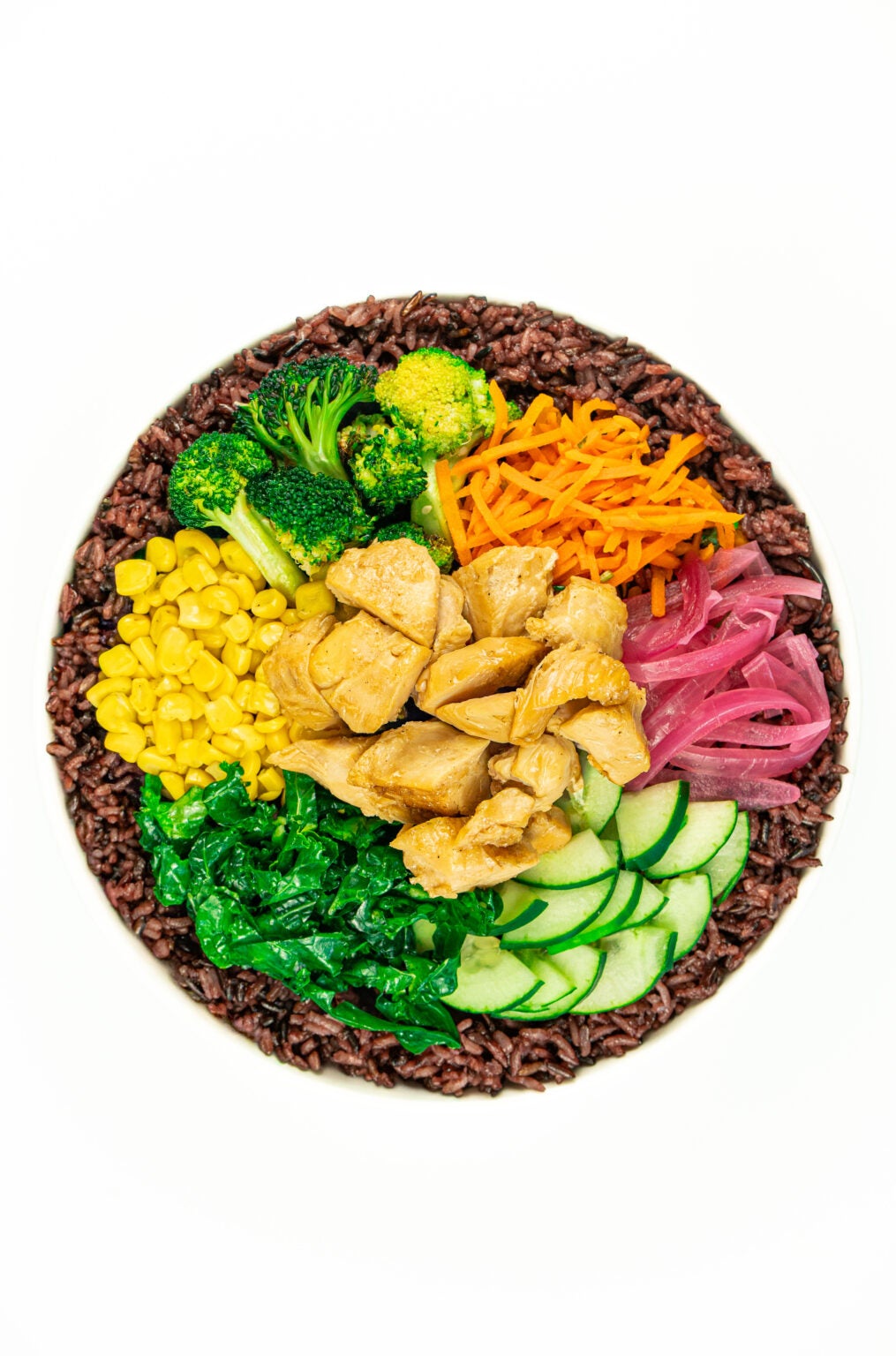 BIBIBOP Chicken bowl on Purple Rice with Roasted Sesame Broccoli, Corn, Carrots, Cucumber, Kale and Pickled Red Onion