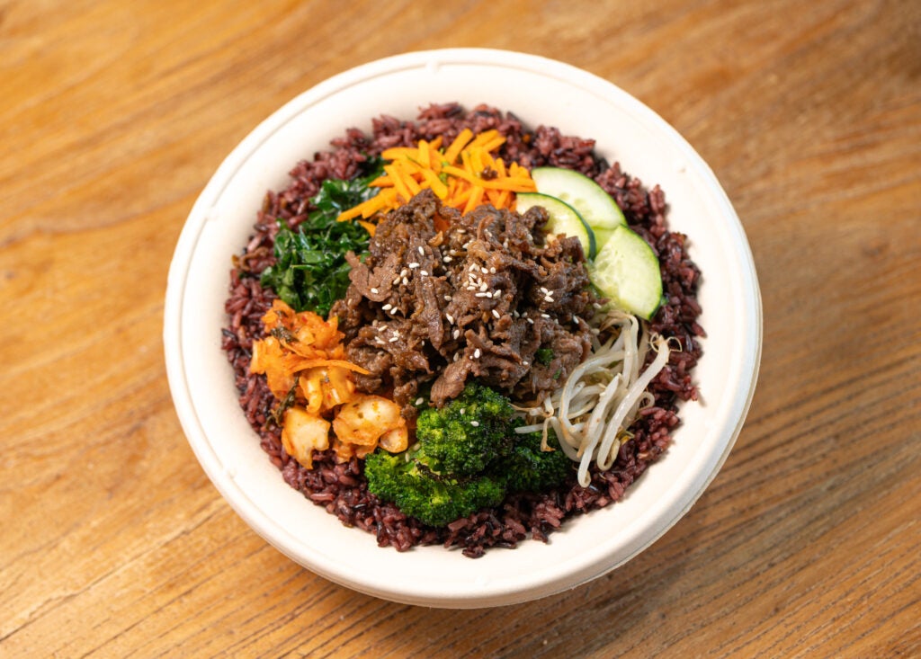 BIBIBOP Korean BBQ Beef bowl on Purple Rice with Roasted Sesame Broccoli, Kale, Carrots, Cucumber and Bean Sprouts